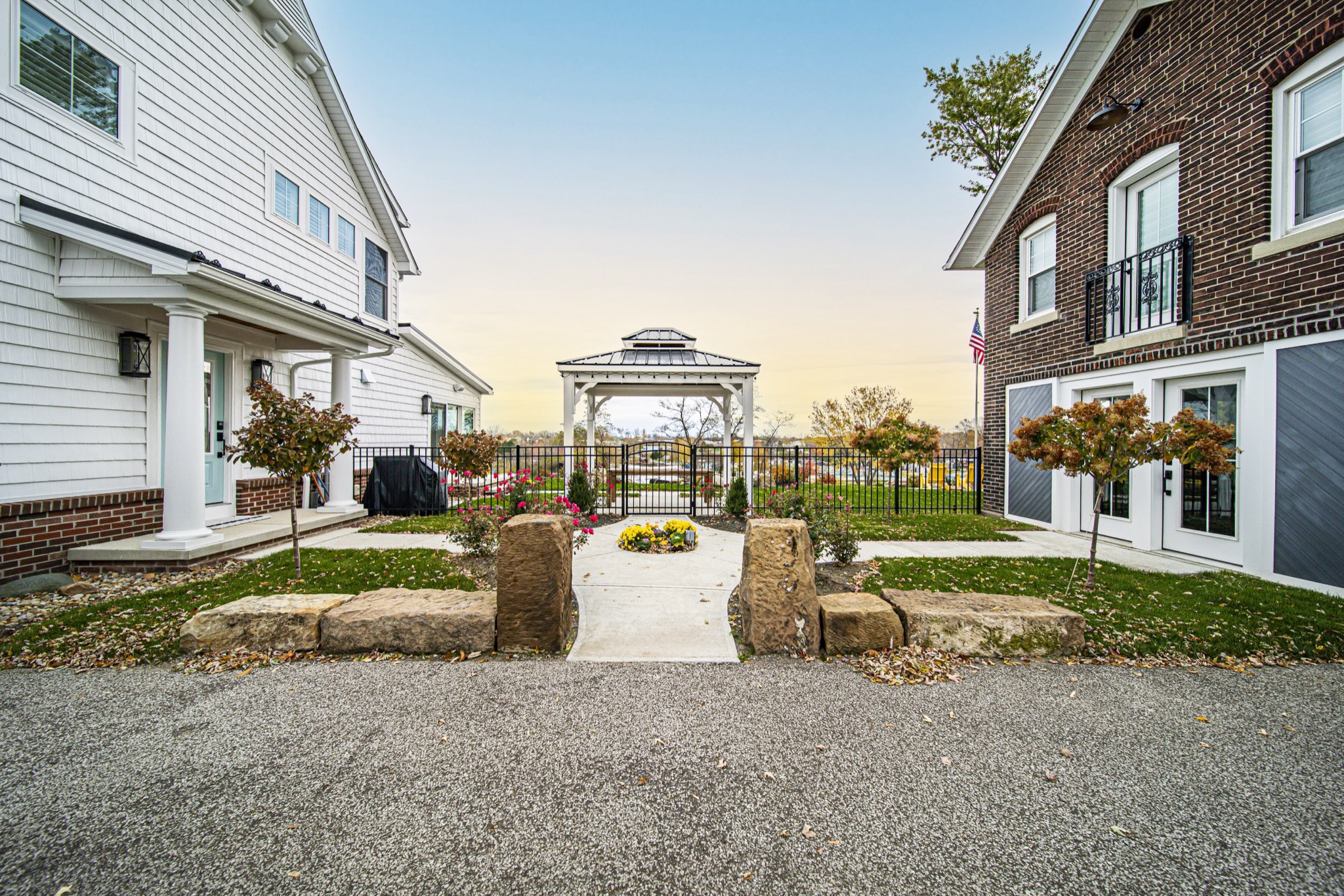 Stone and cedar craftsman home with covered patio — Skoda Construction