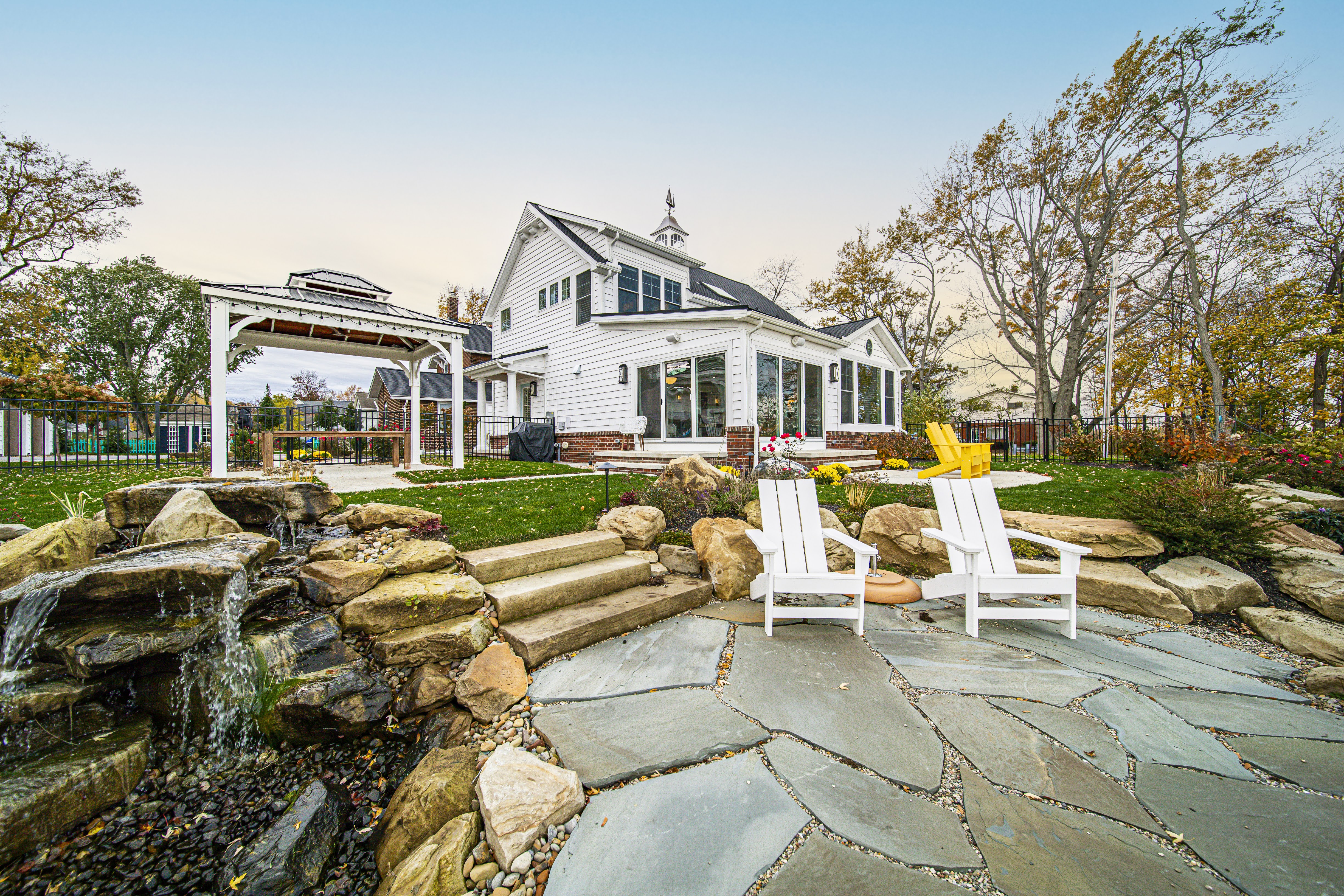 Two-story great room with timber trusses — Gates Mills Residence