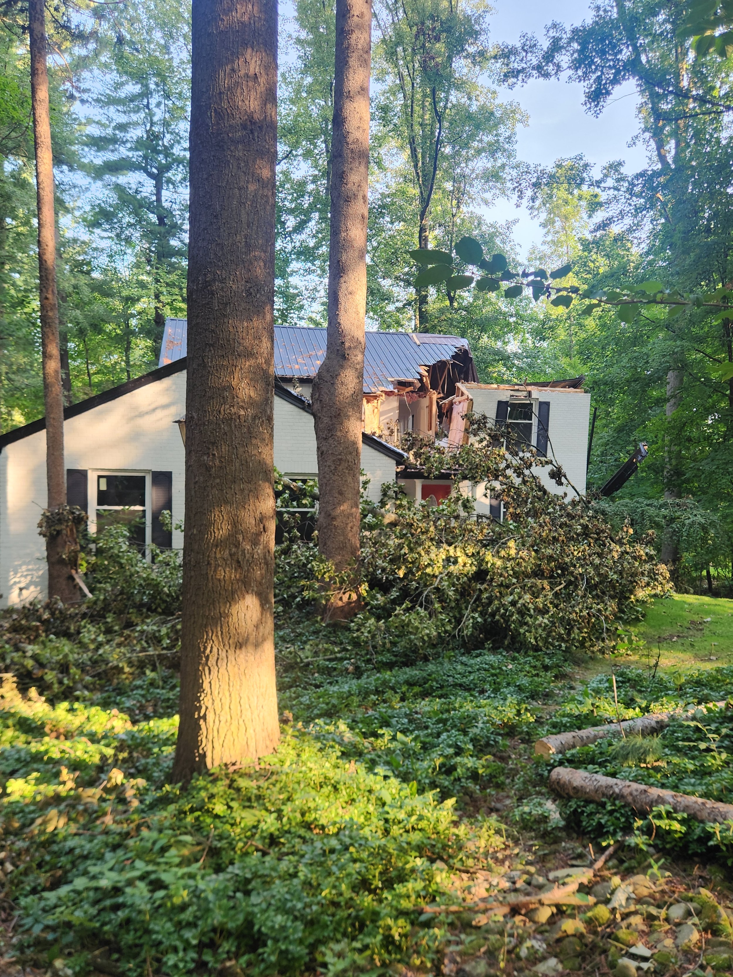 Roof Collapse — Storm damage to roof — emergency tarping and full rebuild